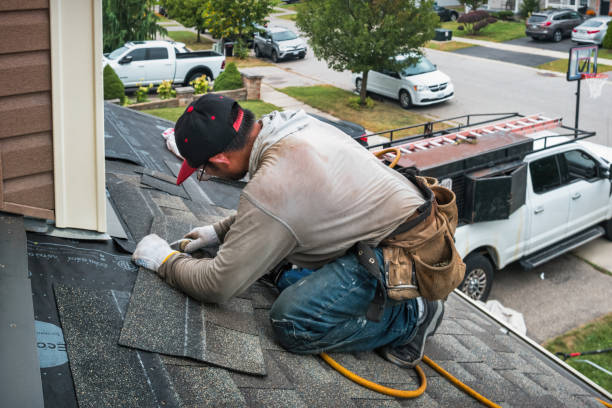 Professional Roof Repair technician working in Wheelwright, MA